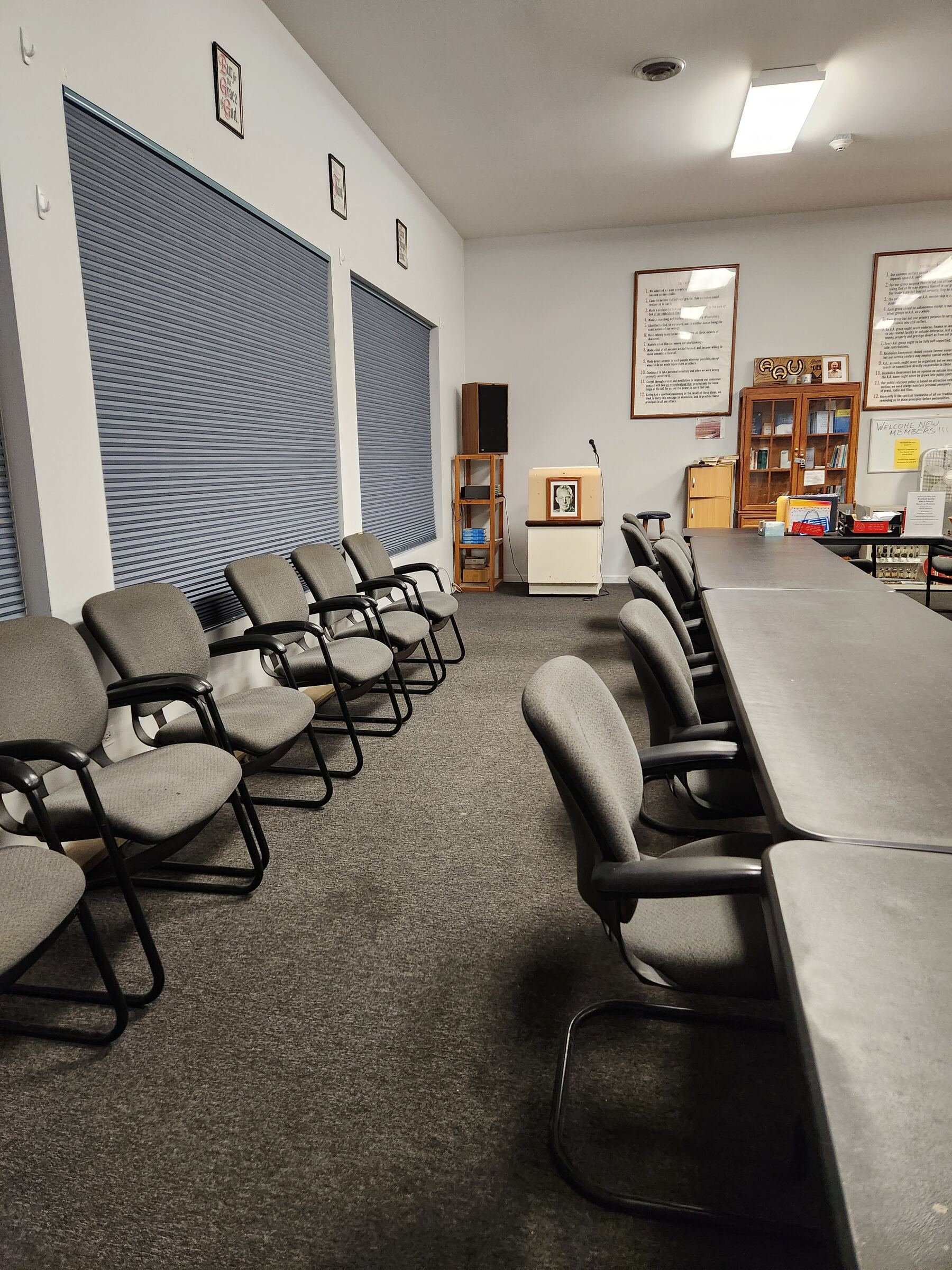 The club’s meeting room with chairs set out and a long table